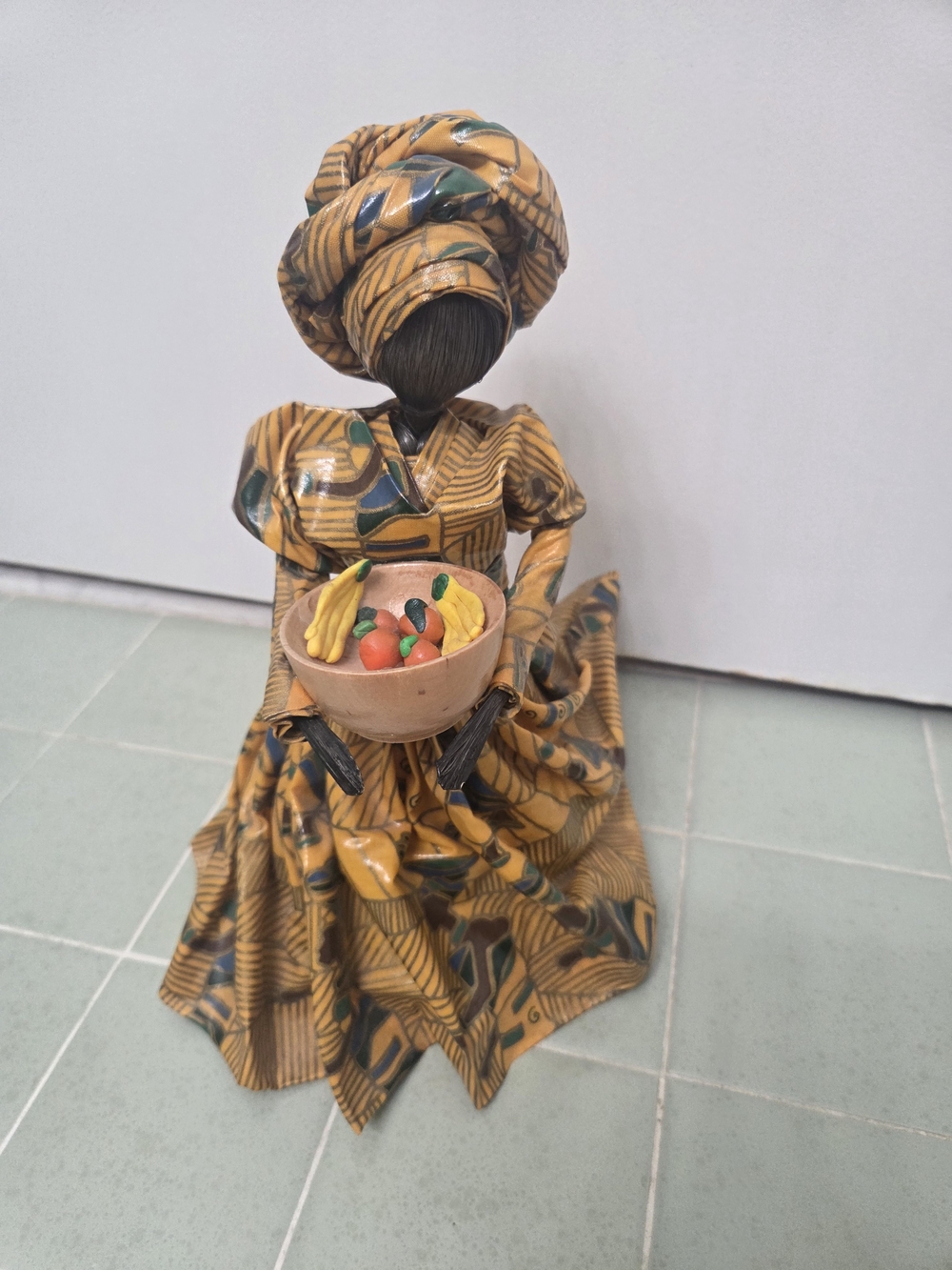 Handcrafted  African Woman Figurine Holding Fruit Bowl By Doris McGillan